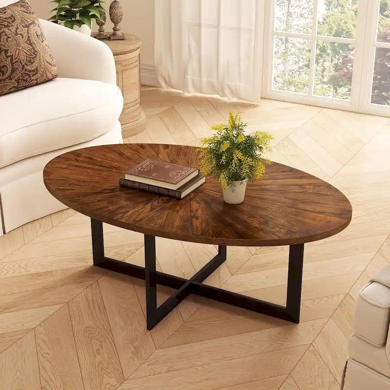 Table basse ovale contemporaine en bois massif avec pieds métalliques croisés