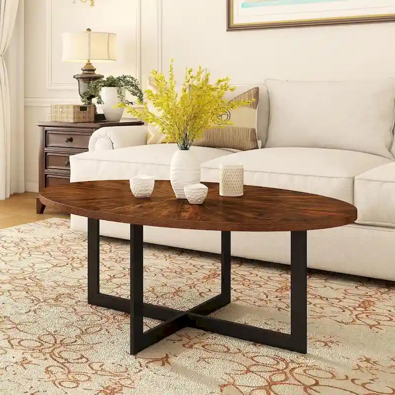 Table basse ovale contemporaine en bois massif avec pieds métalliques croisés