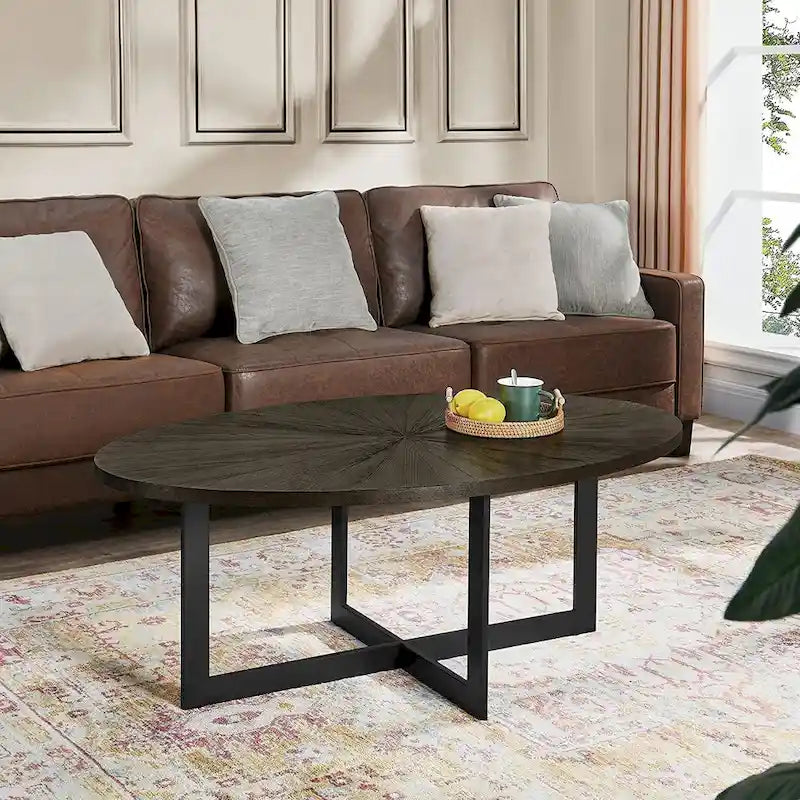 Table basse ovale contemporaine en bois massif avec pieds métalliques croisés