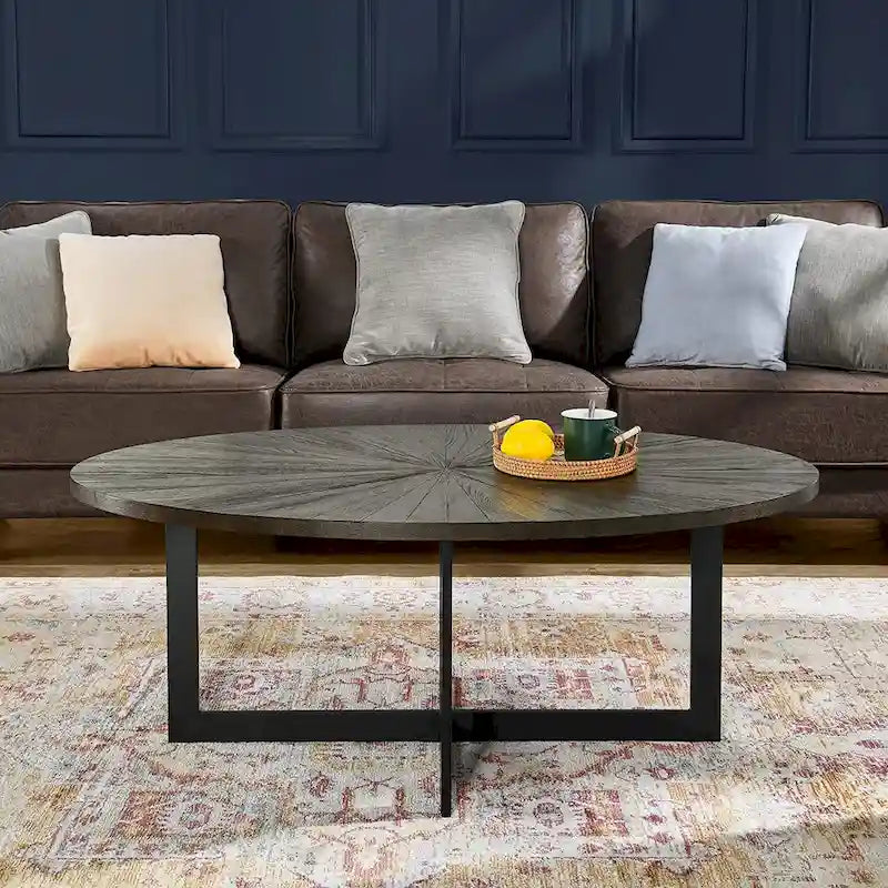 Table basse ovale contemporaine en bois massif avec pieds métalliques croisés