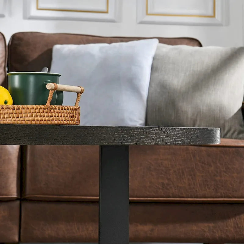 Table basse ovale contemporaine en bois massif avec pieds métalliques croisés