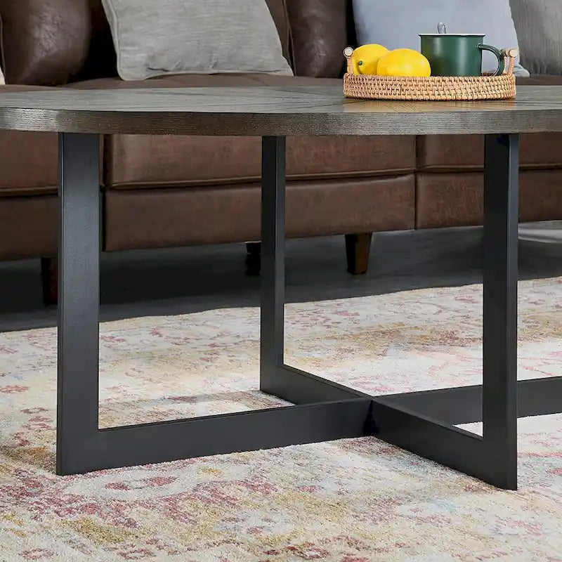 Table basse ovale contemporaine en bois massif avec pieds métalliques croisés